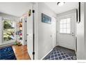 Bright entryway featuring slate floors, coat hooks, and easy access to living spaces at 3209 Redstone Rd # 12B, Boulder, CO 80305