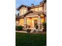 Inviting brick front porch features craftsman columns, neutral paint, and decorative wreath at 3502 Birch Ave, Parker, CO 80134