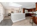 Bright and airy kitchen featuring sleek cabinetry, stainless steel appliances, and an adjacent dining area with modern lighting at 5743 Field St, Arvada, CO 80002