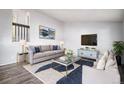 Bright living room with a modern color scheme and stylish decor at 7773 Brentwood Ct, Arvada, CO 80005