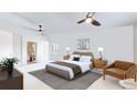 Bedroom suite with an ensuite bath, ceiling fan, and neutral tones for a bright and inviting space at 775 S Alton Way # 3D, Denver, CO 80247