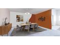 Dining area featuring stylish light fixture, modern decor, and seating for six at 775 S Alton Way # 3D, Denver, CO 80247