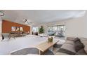 Spacious living room with lots of natural light, slider to an outdoor patio, and comfortable seating at 775 S Alton Way # 3D, Denver, CO 80247