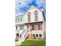 Attractive townhome showcasing classic architectural details and a welcoming entrance at 9512 W Ontario Dr, Littleton, CO 80128