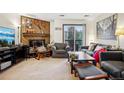 Cozy living room features a fireplace, sliding glass doors to the balcony, and comfortable seating at 2900 Shadow Creek Dr # 201, Boulder, CO 80303