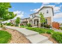 Attractive street view showcasing well-maintained homes with landscaped yards and sidewalks, creating a welcoming neighborhood ambiance at 11761 Cord Grass Way, Parker, CO 80138