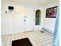 Entryway with tile floors, interior doors and hardware, and exterior door at 8826 E Florida Ave # 102, Denver, CO 80247