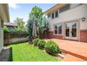 A charming backyard featuring a patio area, perfect for outdoor entertaining and relaxation at 1934 S Sherman St, Denver, CO 80210