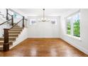 Bright dining area with hardwood floors and staircase at 1934 S Sherman St, Denver, CO 80210