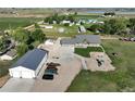 Aerial view of property showing the home, large shop, and surrounding land at 6331 County Road 32, Platteville, CO 80651