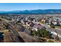 Breathtaking aerial view showcasing a vibrant neighborhood with stunning mountain views at 15653 Split Creek Dr, Monument, CO 80132