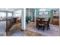 Cozy dining area featuring tile floors, wood furniture, and ample natural light, ready for Gathering meals at 15653 Split Creek Dr, Monument, CO 80132