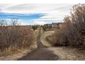 Picturesque neighborhood trail surrounded by nature, perfect for walking, running, and enjoying the outdoors at 15653 Split Creek Dr, Monument, CO 80132