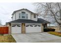 Charming two-story home featuring a three-car garage and traditional architectural details at 12135 Elizabeth St, Thornton, CO 80241
