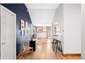 Inviting hallway with stylish decor, hardwood floors, and seamless transition to adjacent rooms at 2351 Federal Blvd # 102, Denver, CO 80211