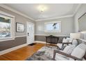 Welcoming foyer with hardwood floors, neutral paint, and ample natural light at 2541 Cherry St, Denver, CO 80207