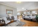 Bright living room with hardwood floors, fireplace, and stylish decor at 2541 Cherry St, Denver, CO 80207