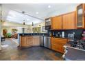 Open kitchen with wood cabinets, stainless steel appliances, and a view to the living room at 167 Independence Cir, Breckenridge, CO 80424