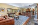 An open floor plan featuring a living room with a kitchen area with a bar and seating at 167 Independence Cir, Breckenridge, CO 80424