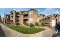 Condo building with balconies and green space. Great landscaping around the building and well maintained at 3035 Blue Sky Cir # 10-207, Erie, CO 80516