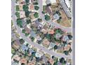 Aerial view of a residential neighborhood showcasing the property's location within the community and nearby amenities at 8319 Quivas Way, Denver, CO 80221