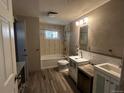 Functional bathroom featuring neutral walls, window, and updated vanity at 8319 Quivas Way, Denver, CO 80221