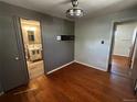 Cozy bedroom featuring hardwood floors, neutral walls, and natural lighting at 8319 Quivas Way, Denver, CO 80221
