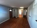 Spacious living room featuring hardwood floors, neutral walls, and a welcoming entry at 8319 Quivas Way, Denver, CO 80221