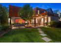Beautiful backyard with mature landscaping, a spacious patio, and inviting seating areas at 14 S Grape St, Denver, CO 80246