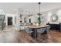 Bright dining room features modern lighting, stylish decor, and seamless access to the kitchen at 14 S Grape St, Denver, CO 80246