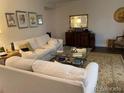 Inviting living room with a cozy white sofa and a decorative rug at 9060 E Cherry Creek South Dr # E, Denver, CO 80231