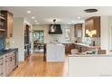 Modern kitchen with wood cabinets and large island at 2512 Premier Pl, Boulder, CO 80304