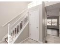 Bright entryway with staircase, storage closet, and view to living area at 15907 E 13Th Ave, Aurora, CO 80011