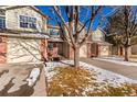 Attractive townhome with a two-car garage and landscaping at 15907 E 13Th Ave, Aurora, CO 80011