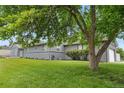 Charming single-story home with a well-maintained lawn and mature trees in a desirable neighborhood at 7155 E Exposition Ave, Denver, CO 80224