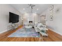 Bright living room with vaulted ceilings, marble fireplace and stylish decor at 7155 E Exposition Ave, Denver, CO 80224