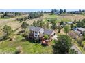 Aerial view of a spacious home nestled in a scenic neighborhood with lush surroundings at 7388 S Ireland Cir, Centennial, CO 80016