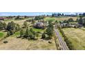 An elevated view of a property showcasing its landscaping and scenic, idyllic, green surroundings at 7388 S Ireland Cir, Centennial, CO 80016