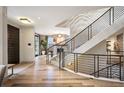 Well lit entry foyer with stairs and hardwood floors at 424 Grape St, Denver, CO 80220