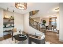 An elegant living room features a modern staircase and stylish decor at 424 Grape St, Denver, CO 80220