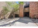 Building exterior with brick facade, stone landscaping, and unit number display at 12354 W Nevada Pl # 102, Lakewood, CO 80228