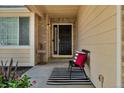 Inviting front porch with stylish decor, offering a warm welcome to guests at 18647 E Berry Dr, Aurora, CO 80015