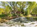 Picturesque backyard with a pond, a fountain and deck at 3935 Pierson St, Wheat Ridge, CO 80033