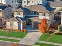 An elevated shot of a home highlighting its architectural design, landscaping, and surrounding neighborhood at 515 Orion Ave, Erie, CO 80516