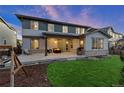 This is a view of an outdoor patio featuring string lights and a seating area for relaxation at 515 Orion Ave, Erie, CO 80516