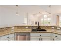 Modern kitchen featuring granite countertops, stainless steel appliances, and open concept layout at 8525 E 149Th Dr, Thornton, CO 80602