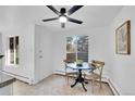 Bright dining area with a ceiling fan, a round table and natural light at 2700 S Holly St # 107, Denver, CO 80222