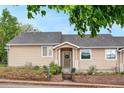Street view of a single Gathering home showing the front yard landscaping, covered porch, and new roof at 2985 W 46Th Ave, Denver, CO 80211