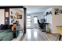 Bright living room with modern flooring, work space and comfortable seating at 2852 W Ellsworth Ave, Denver, CO 80219