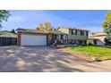 House exterior with a two-car garage and front porch at 2519 S Sable Way, Aurora, CO 80014